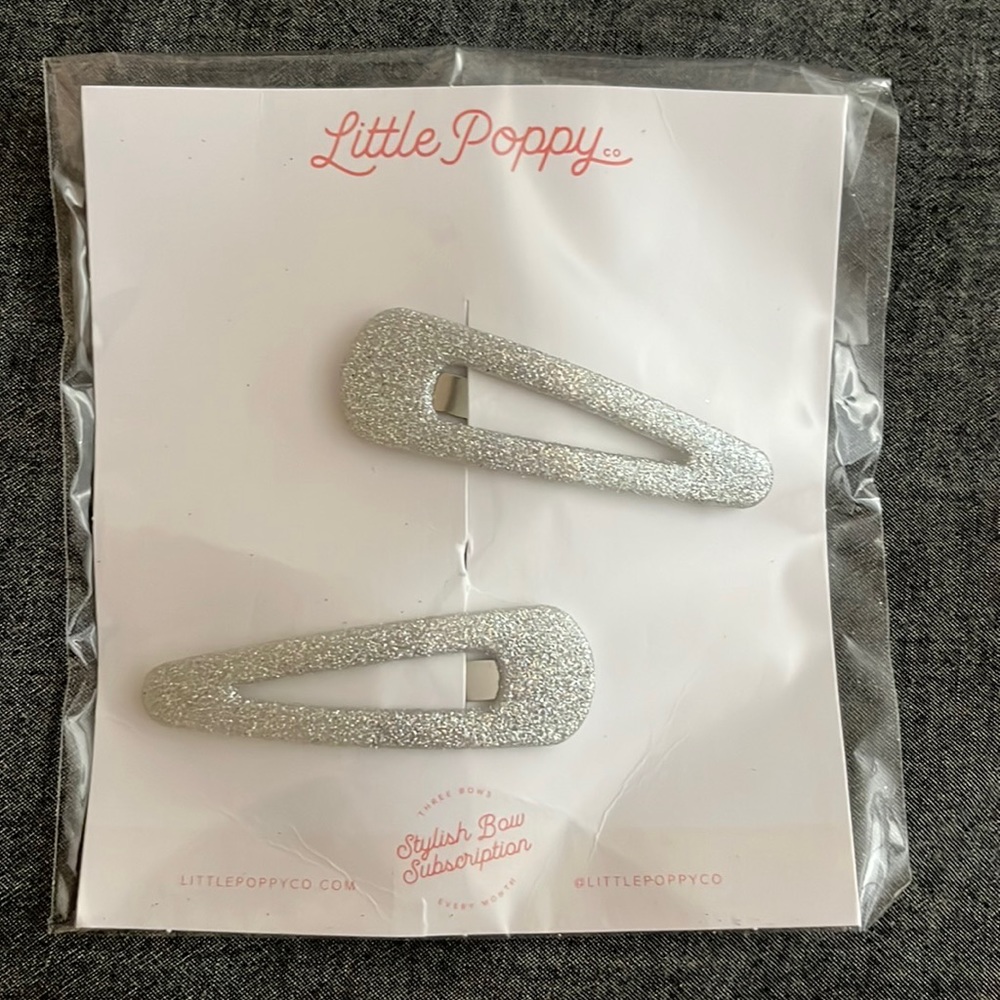 2 large silver glitter hair clips
